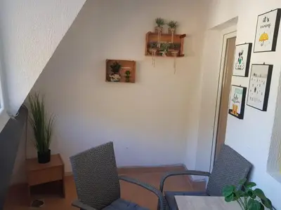 a dining room with two chairs and a table at Košuta 21 Center Duplex Apartment, Brzeće in Brzeće