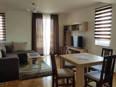 a living room with a couch and a table at Apartman Kala in Vrnjačka Banja