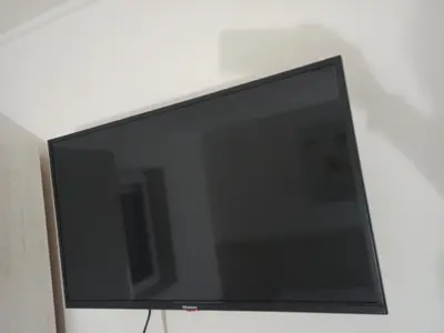 a flat screen tv sitting on a white wall at Lili apartman u parku in Vrnjačka Banja
