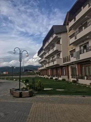 a building with a street light in front of it at Studio Milmari ,Premier 18 in Kopaonik