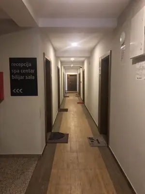 a hallway of a building with a sign on the wall at Studio Milmari ,Premier 18 in Kopaonik