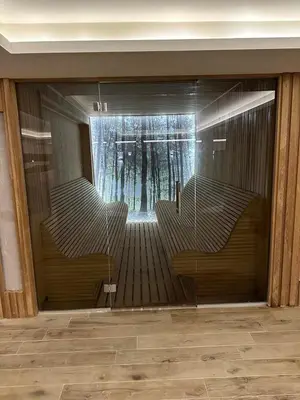 a reflection of a room with stairs and trees at Apartmani Fashion -Milmari Resort in Kopaonik