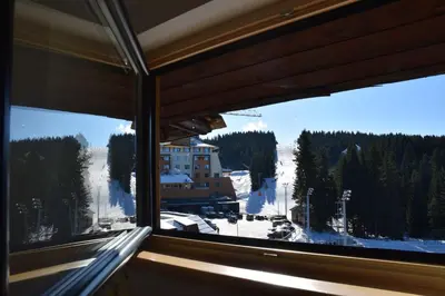 a view of a ski slope from a window at Family Lux Apartmani Angella Konaci in Kopaonik