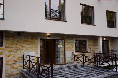 a building with a front door and windows at Apartman Suny N58 in Kopaonik