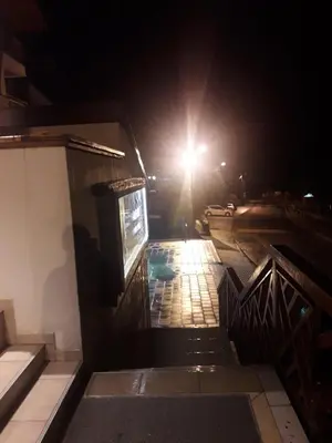 a building with a light on a street at night at Kopaonik Foka Spa Brzeće in Brzeće
