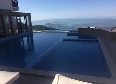 a swimming pool on the side of a building at Studio Apartment Station Kopaonik,Milmari Resort in Kopaonik