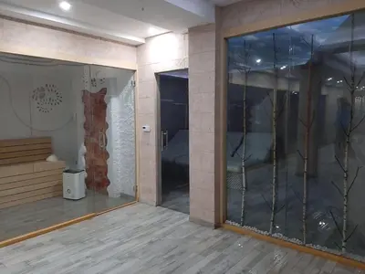an empty room with a glass door in a building at Studio Apartment Station Kopaonik,Milmari Resort in Kopaonik
