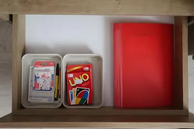 two plastic containers sitting on a shelf next to a red refrigerator at Nana S44 Milmari Spa&Wellness in Kopaonik