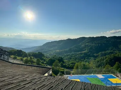 a view of the mountains from the roof of a building at Nana S44 Milmari Spa&Wellness in Kopaonik