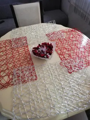 a table with red and white nets on it at Andrina Sweet Home in Niš