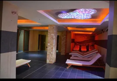 a room with several beds on display in a building at Apartman “EMI” in Kopaonik
