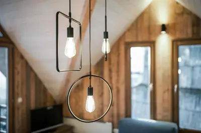 a group of lights hanging from a ceiling at Kostovac Boutique Homes - Loft in Kopaonik