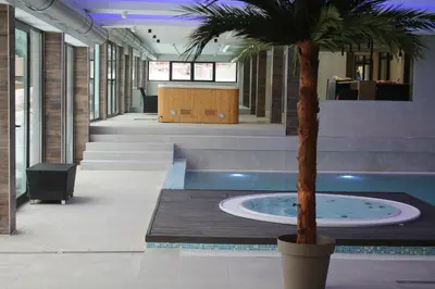 a palm tree in the middle of a lobby at Sunčani breg in Kopaonik