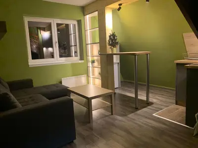 a living room with a couch and a table at G&D Apartment Kopaonik in Kopaonik