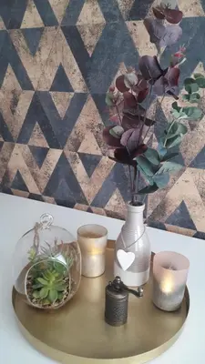 a tray with a vase with candles and flowers on it at Apartman Žuta dunja - Sunčani breg in Kopaonik