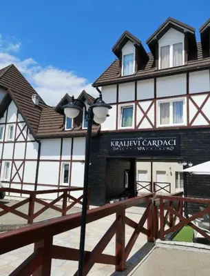 a building with a street light in front of it at Milmari apartman SAN-28 in Kopaonik