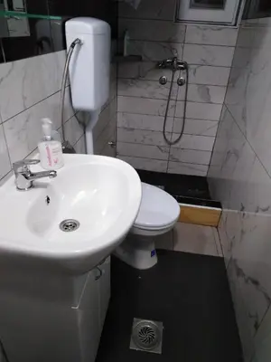 a bathroom with a sink and a toilet at Apartmani Marić in Vrnjacka Banja in Vrnjačka Banja