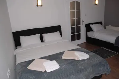 a bedroom with two beds with towels on it at Stan na dan - apartman Djordjevic in Vranje