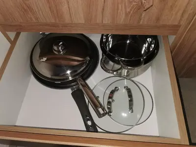 a shelf with two utensils in a drawer at S 68, Milmari Resort in Kopaonik