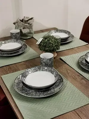 a wooden table with plates and dishes on it at S 68, Milmari Resort in Kopaonik