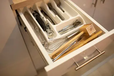 a drawer in a kitchen with utensils at Dream Lux Apartman Kopaonik in Kopaonik