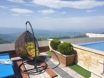 a basket of fruit on the balcony of a house at Dream Lux Apartman Kopaonik in Kopaonik