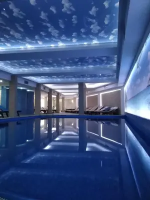 a swimming pool with a starry sky ceiling at Milmari-Apartman MARA L30 in Kopaonik