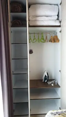 a walk in closet with shelves and towels at Milmari resort Sara P61 in Kopaonik