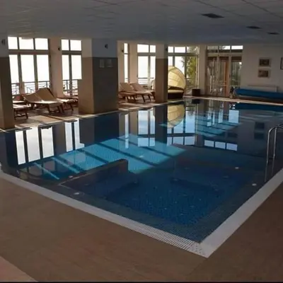 a large swimming pool in a large building at Milmari Resort Maša S6 in Kopaonik