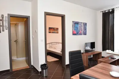 a living room with a door leading to a bedroom at Private apartman 5b23 in Kraljevi cardaci in Kopaonik