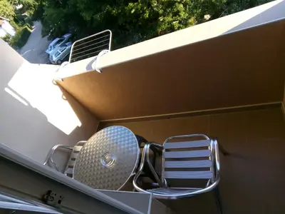 a chair sitting on top of a building at Smeštaj Milenković in Soko Banja