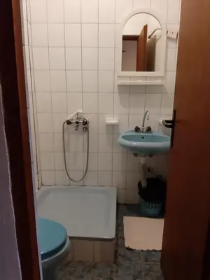 a bathroom with a tub and a toilet and a sink at Šumatovac in Aleksinac