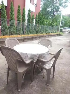a white table with two chairs around it at Vlajkovic apartmani 2 in Vrnjačka Banja
