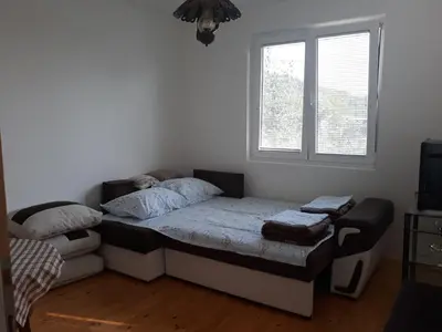 a small bedroom with a bed and a window at Seosko turisticko domaćinstvo Jagor in Despotovac