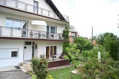 an image of a house with a yard at Sokobanja Smeštaj Pavlović & privatan parking in Soko Banja