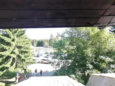 a view of a parking lot from a porch at Konaci apartman Hani in Kopaonik