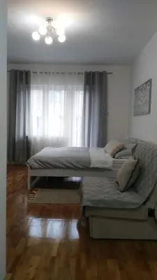 a bedroom with two beds and a window at Apartman - Studio Prnic in Soko Banja