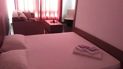 a bedroom with a bed with two towels on it at Dream House in Kruševac