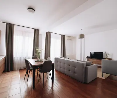 a living room with a couch and a table at Pegaz Holiday Resort in Vrnjačka Banja