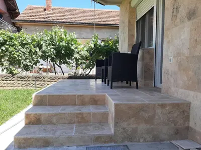 a group of chairs sitting on top of some stairs at Nikolic Apartment 2 in Leskovac