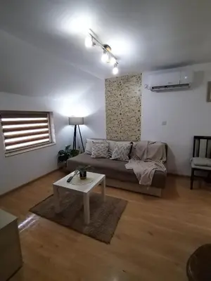 a living room with a couch and a table at STEFAN in Vrnjačka Banja