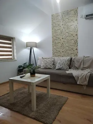 a living room with a couch and a coffee table at STEFAN in Vrnjačka Banja