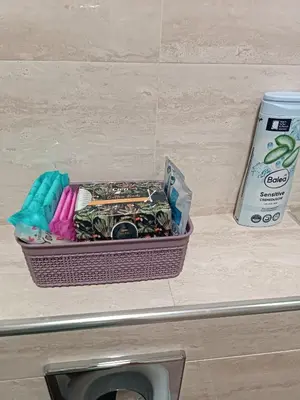 a basket of toothbrushes sitting on a bathroom counter at Apartman Dana in Soko Banja