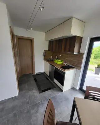 a kitchen with a sink and a stove at Duos East in Soko Banja