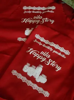 a red shirt with white words on a red blanket at Vila Happy Story in Knjazevac.