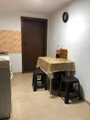 a table with a table cloth on it in a kitchen at Vila Happy Story in Knjazevac.