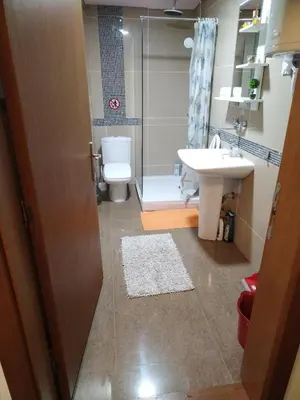 a bathroom with a sink and a toilet and a shower at Raj Pegaz in Vrnjačka Banja