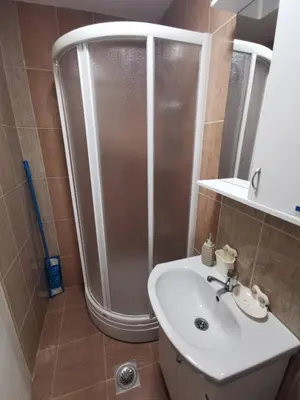 a bathroom with a shower and a sink at Comfort Inn Apartmani in Vrnjačka Banja