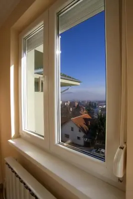 a window with a view of a city at Apartman NEDA - 5 minuta od centra in Vrnjačka Banja