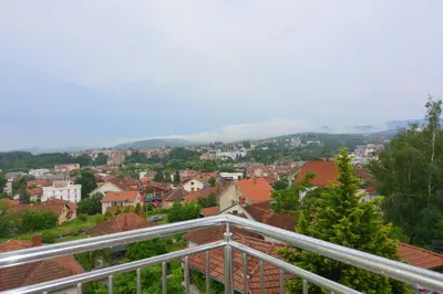 a view of a city from a balcony at Apartman NEDA - 5 minuta od centra in Vrnjačka Banja